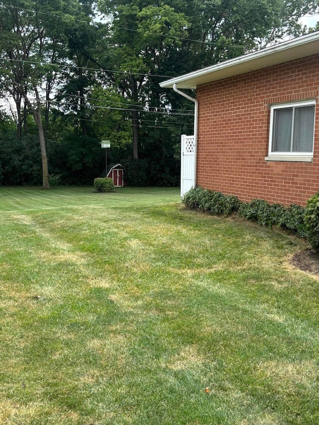 3281 Darracq Cir, Columbus, OH 43223 - view of green lawn featuring a storage shed