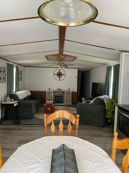 1231 Parkway Dr Lot # 26, Logan, OH 43138 - dining space featuring wood finished floors, ceiling fan, and plenty of natural light