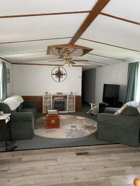 1231 Parkway Dr Lot # 26, Logan, OH 43138 - living room with wood finished floors, a ceiling fan, and a fireplace