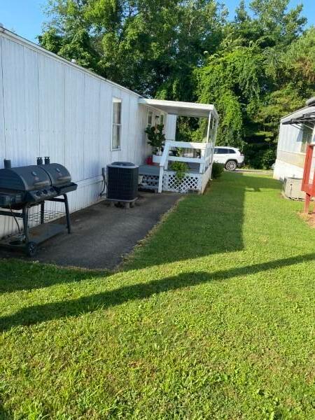 1231 Parkway Dr Lot # 26, Logan, OH 43138 - view of grassy yard with a patio area