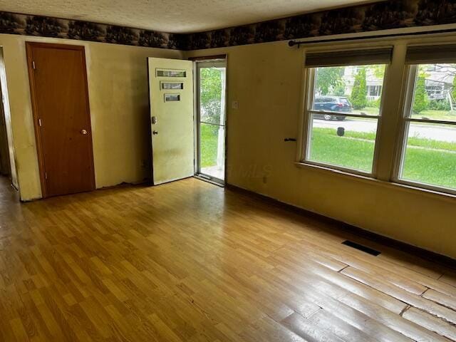 284 Old Village Rd, Columbus, OH 43228 - unfurnished room with wood finished floors and a textured ceiling