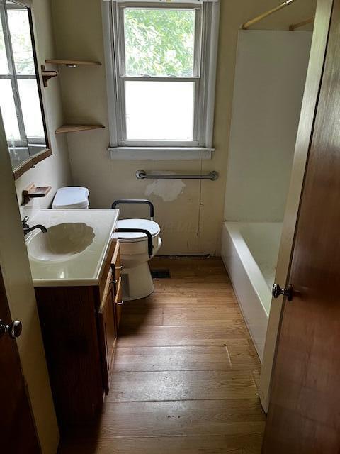 284 Old Village Rd, Columbus, OH 43228 - full bath featuring vanity, hardwood / wood-style flooring, and  shower combination