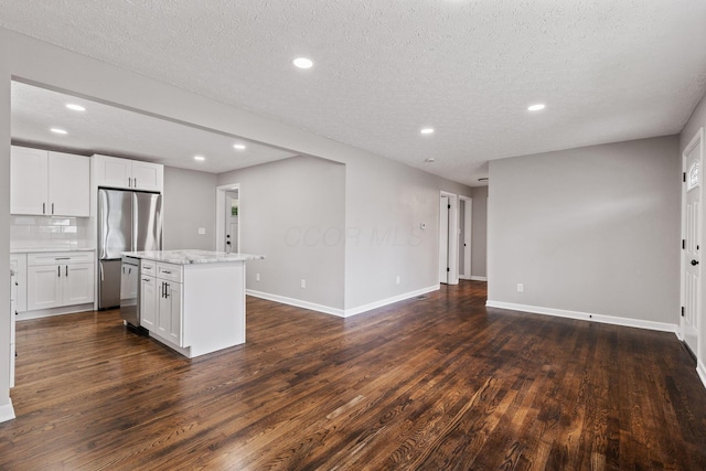 4256 Eleanor Ave, Grove City, OH 43123 - kitchen with a center island, dark wood-type flooring, recessed lighting, appliances with stainless steel finishes, and white cabinets