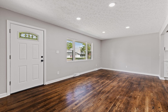 4256 Eleanor Ave, Grove City, OH 43123 - entryway with dark wood-type flooring, a textured ceiling, and recessed lighting