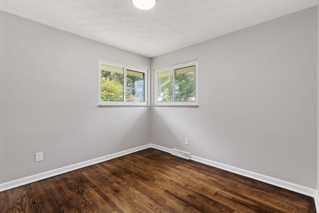 4256 Eleanor Ave, Grove City, OH 43123 - unfurnished room featuring dark wood-type flooring and a textured ceiling