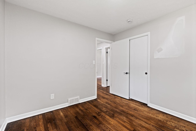 4256 Eleanor Ave, Grove City, OH 43123 - unfurnished bedroom with dark wood-style flooring and a closet