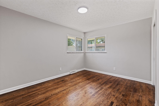 4256 Eleanor Ave, Grove City, OH 43123 - spare room with dark wood-style floors and a textured ceiling