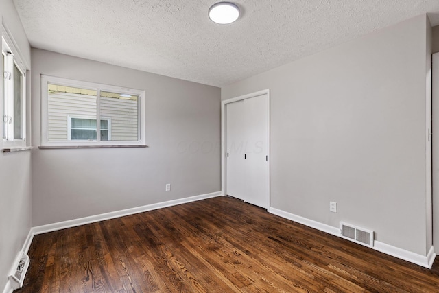 4256 Eleanor Ave, Grove City, OH 43123 - spare room with wood finished floors and a textured ceiling