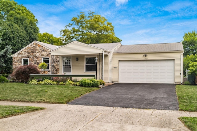 5950 Ambleside Dr, Columbus, OH 43229 - ranch-style home with asphalt driveway, a front yard, a porch, and a garage