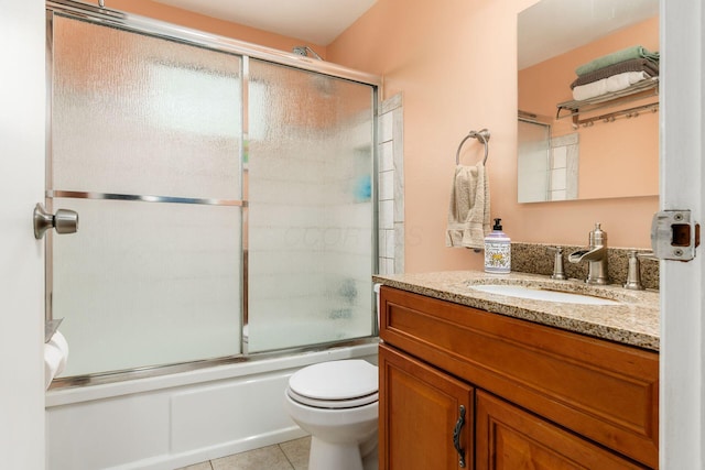 5950 Ambleside Dr, Columbus, OH 43229 - full bathroom featuring vanity, enclosed tub / shower combo, and tile patterned floors