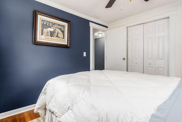 5950 Ambleside Dr, Columbus, OH 43229 - bedroom with wood finished floors, ornamental molding, a closet, and a ceiling fan