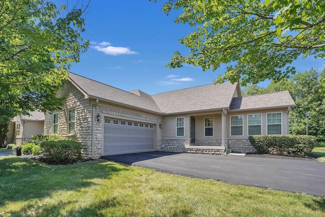 4887 Rays Cir, Dublin, OH 43016 - ranch-style house featuring an attached garage, asphalt driveway, and a front yard