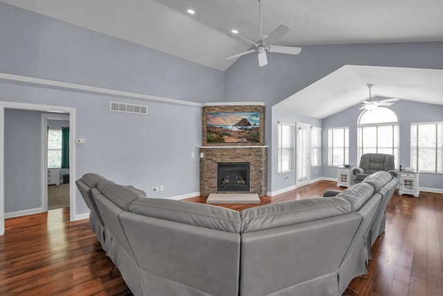 4887 Rays Cir, Dublin, OH 43016 - living area featuring ceiling fan, plenty of natural light, dark wood-style flooring, a stone fireplace, and high vaulted ceiling