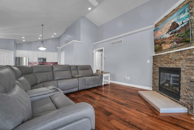4887 Rays Cir, Dublin, OH 43016 - living area featuring a stone fireplace, high vaulted ceiling, dark wood-style flooring, a ceiling fan, and recessed lighting