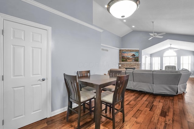 4887 Rays Cir, Dublin, OH 43016 - dining space featuring a ceiling fan, lofted ceiling, dark wood-style floors, and a fireplace