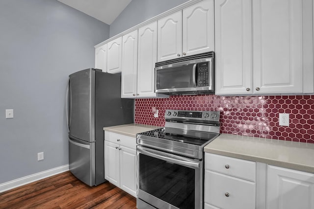 4887 Rays Cir, Dublin, OH 43016 - kitchen with stainless steel appliances, backsplash, white cabinetry, light countertops, and vaulted ceiling