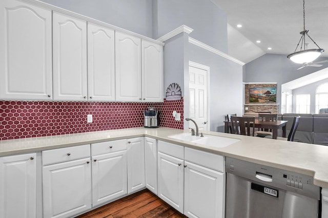 4887 Rays Cir, Dublin, OH 43016 - kitchen with stainless steel dishwasher, backsplash, vaulted ceiling, light countertops, and decorative light fixtures