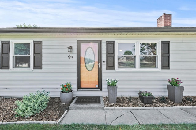 94 Fox Chase Dr, Newark, OH 43055 - view of exterior entry featuring a chimney