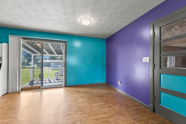 94 Fox Chase Dr, Newark, OH 43055 - unfurnished room with wood finished floors and a textured ceiling