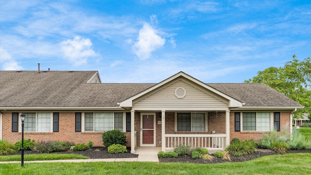 733 Windsor Ln, Heath, OH 43056 - ranch-style house featuring brick siding, a porch, and a shingled roof