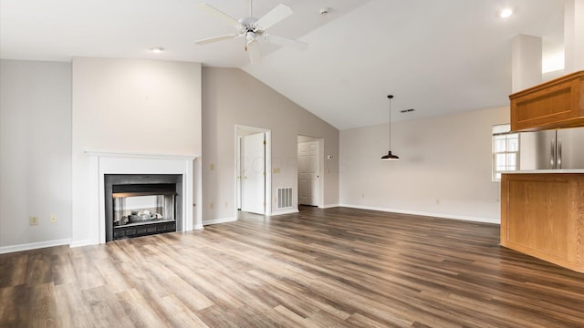 733 Windsor Ln, Heath, OH 43056 - unfurnished living room featuring ceiling fan, dark wood-style floors, a multi sided fireplace, and high vaulted ceiling