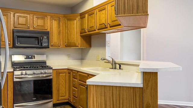 733 Windsor Ln, Heath, OH 43056 - kitchen featuring appliances with stainless steel finishes, light countertops, and dark wood finished floors