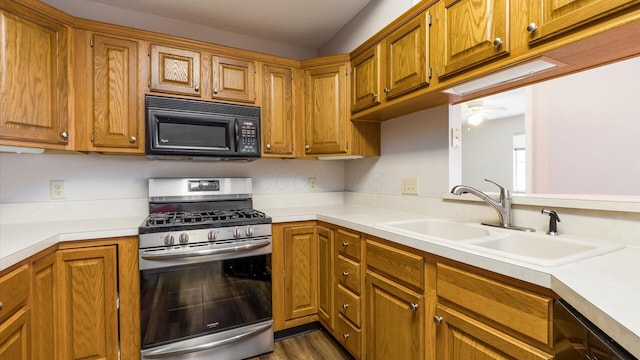 733 Windsor Ln, Heath, OH 43056 - kitchen featuring appliances with stainless steel finishes, light countertops, a ceiling fan, and brown cabinets
