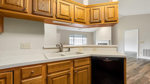 733 Windsor Ln, Heath, OH 43056 - kitchen featuring dishwasher, brown cabinetry, light countertops, and lofted ceiling