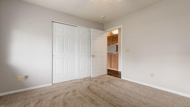 733 Windsor Ln, Heath, OH 43056 - unfurnished bedroom with carpet floors, a closet, and a ceiling fan