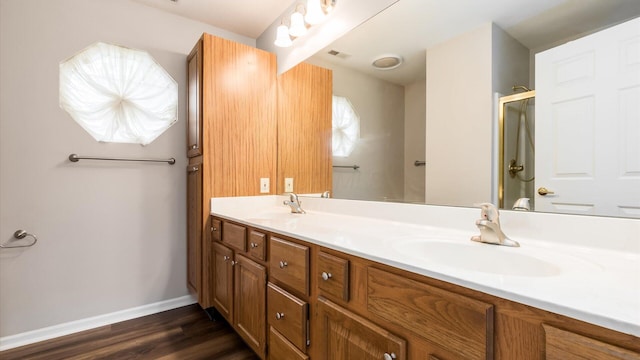 733 Windsor Ln, Heath, OH 43056 - bathroom featuring double vanity and wood finished floors