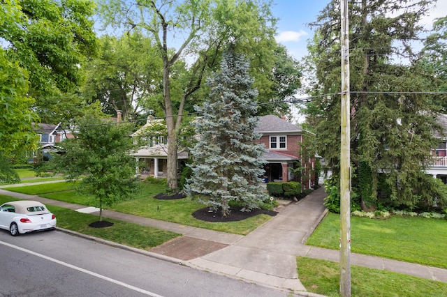 99 E N Broadway St, Columbus, OH 43214 - obstructed view of property featuring a front lawn and a shingled roof