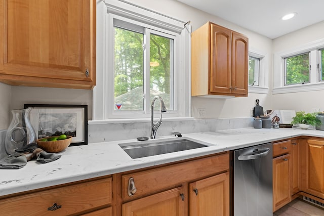 99 E N Broadway St, Columbus, OH 43214 - kitchen featuring dishwasher, light stone countertops, light tile patterned floors, recessed lighting, and brown cabinets