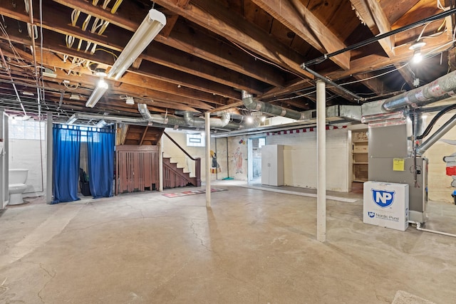99 E N Broadway St, Columbus, OH 43214 - below grade area featuring stairs and heating unit