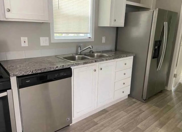 1330 Hanover Rd Unit 507, Delaware, OH 43015 - kitchen featuring appliances with stainless steel finishes, light wood-style flooring, and white cabinets