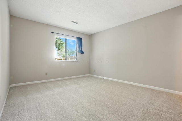 5975 Meadowsglen Dr, Dublin, OH 43017 - spare room with light colored carpet and a textured ceiling
