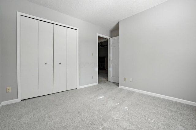 5975 Meadowsglen Dr, Dublin, OH 43017 - unfurnished bedroom featuring carpet floors, a closet, and a textured ceiling