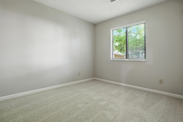 5975 Meadowsglen Dr, Dublin, OH 43017 - unfurnished room with a textured ceiling and light carpet