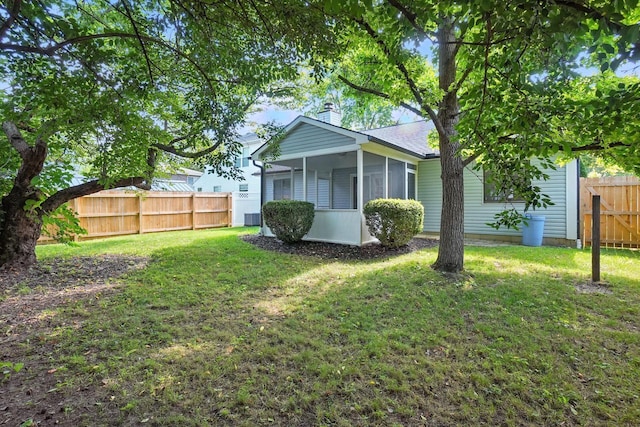 5975 Meadowsglen Dr, Dublin, OH 43017 - back of property featuring a chimney and a sunroom