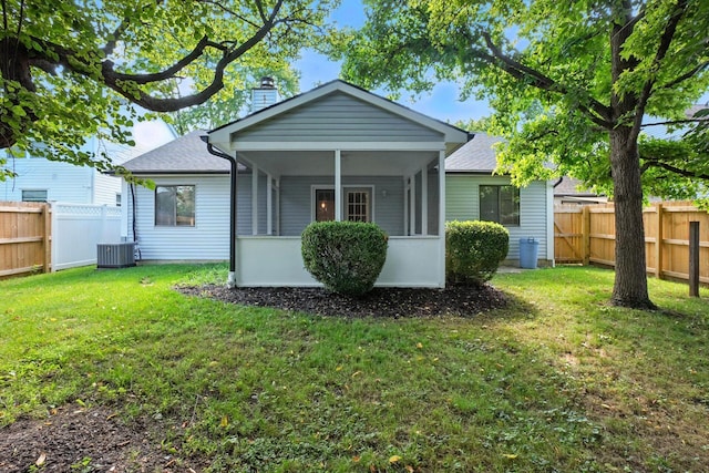 5975 Meadowsglen Dr, Dublin, OH 43017 - back of house with a chimney, a fenced backyard, a shingled roof, and a sunroom