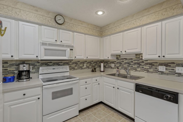 892 Shelbourne Pl, Newark, OH 43055 - kitchen featuring white appliances, light countertops, white cabinets, tasteful backsplash, and a textured ceiling