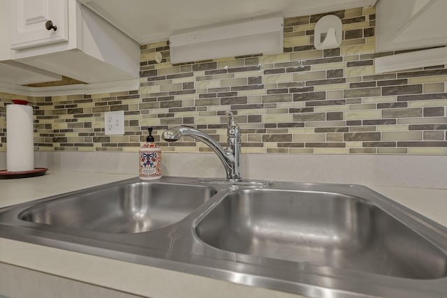 892 Shelbourne Pl, Newark, OH 43055 - kitchen view of tasteful backsplash, white cabinets, and light countertops
