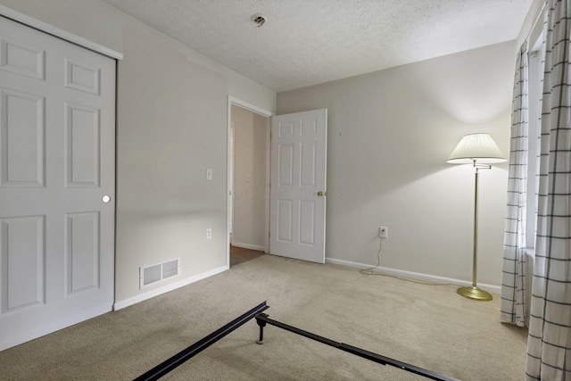 892 Shelbourne Pl, Newark, OH 43055 - unfurnished bedroom featuring carpet and a textured ceiling