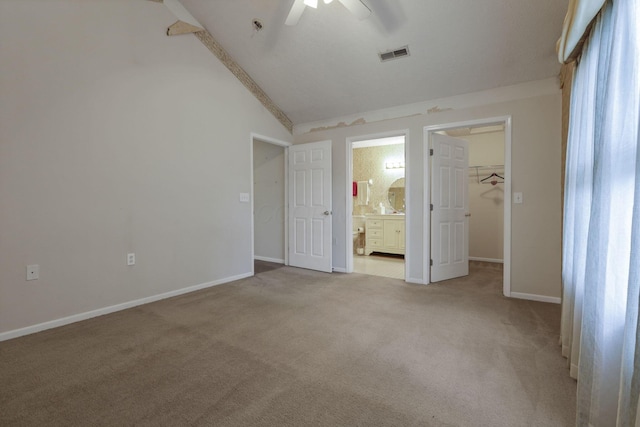 892 Shelbourne Pl, Newark, OH 43055 - unfurnished bedroom featuring vaulted ceiling, carpet, a walk in closet, ensuite bathroom, and a ceiling fan