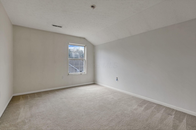 892 Shelbourne Pl, Newark, OH 43055 - carpeted spare room featuring lofted ceiling and a textured ceiling