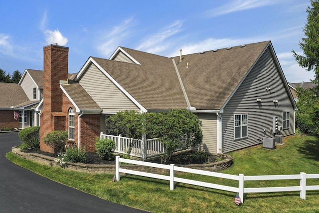 892 Shelbourne Pl, Newark, OH 43055 - view of front of house featuring a shingled roof, a chimney, and brick siding