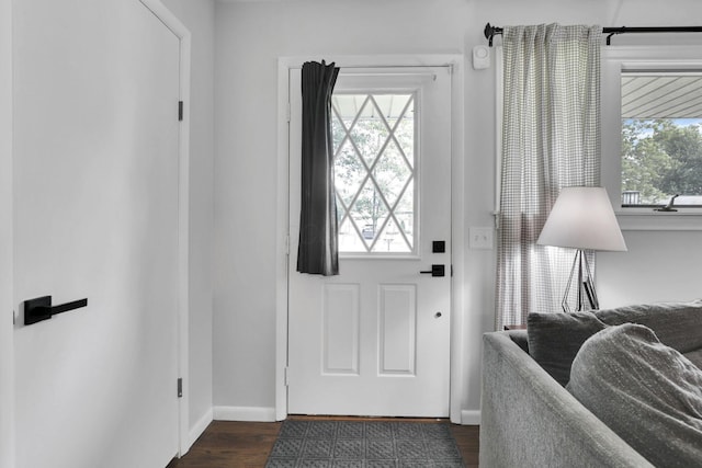 54 Barry Rd SW, Reynoldsburg, OH 43068 - doorway with baseboards and dark wood-style flooring