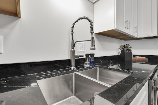 54 Barry Rd SW, Reynoldsburg, OH 43068 - kitchen view of white cabinetry and dark stone counters
