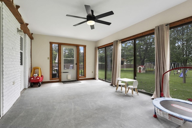 54 Barry Rd SW, Reynoldsburg, OH 43068 - sunroom with carpet flooring and brick wall