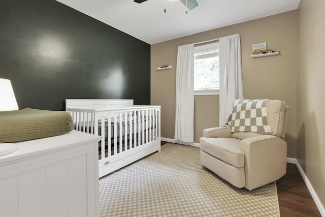 54 Barry Rd SW, Reynoldsburg, OH 43068 - bedroom featuring ceiling fan, a crib, wood finished floors, and lofted ceiling