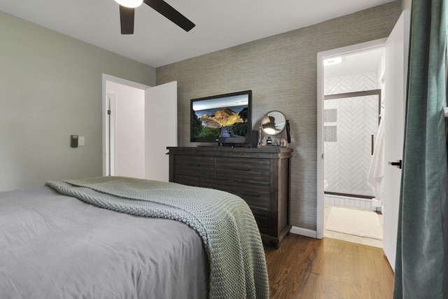54 Barry Rd SW, Reynoldsburg, OH 43068 - bedroom with wood finished floors, a ceiling fan, and ensuite bath